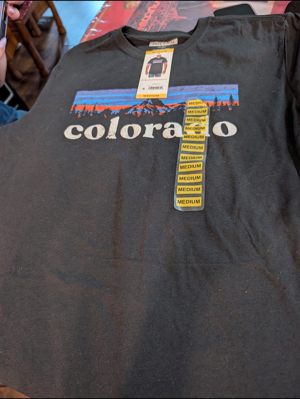 State of Mind Black Tee with Blue, Purple and Orange Mountain Graphic